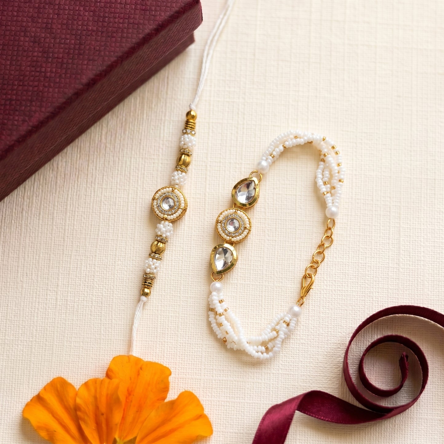 Elegant Pearl Bhai Bhabhi Rakhi Set