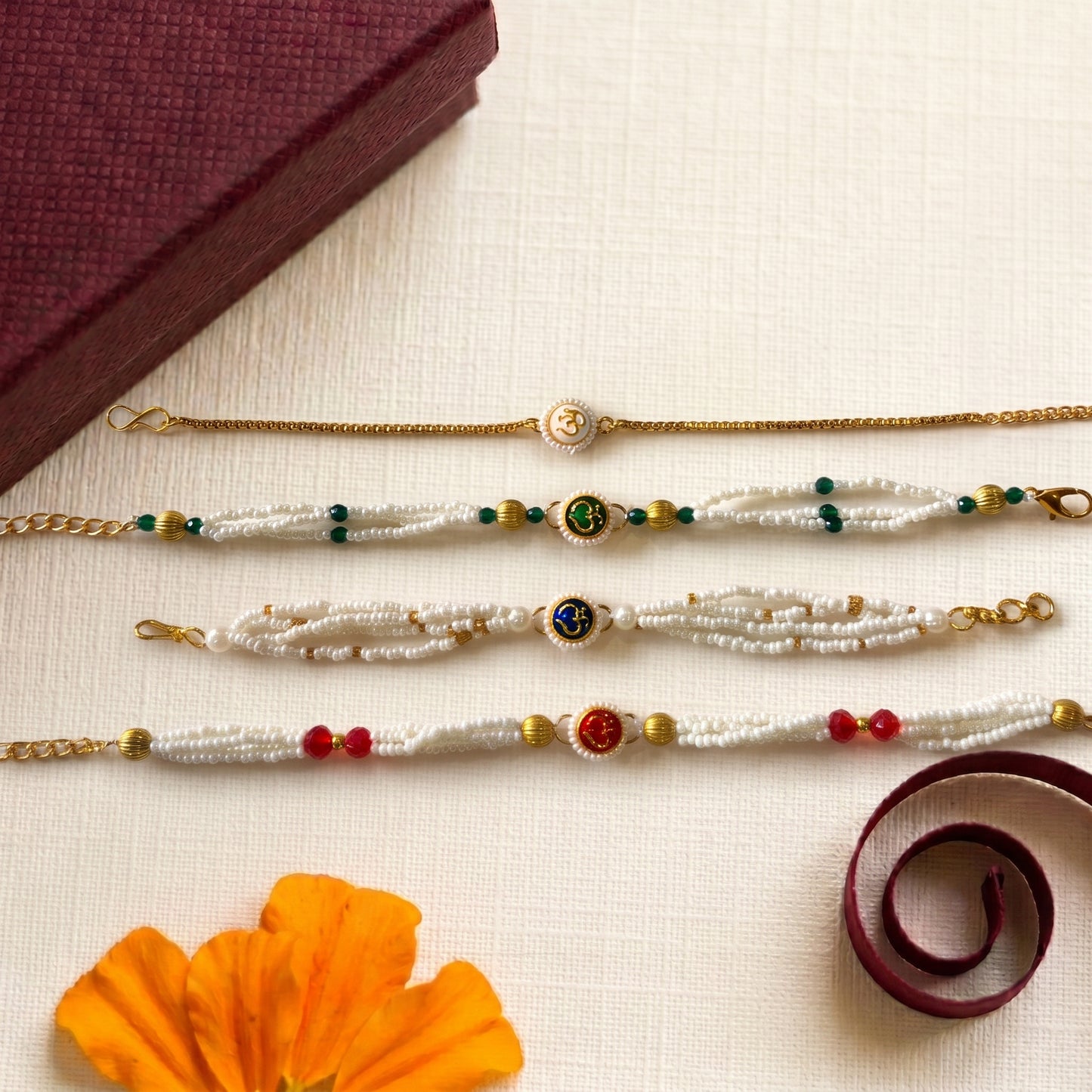 Om Pearl Bracelet Rakhi Collection (Choose Your Design)